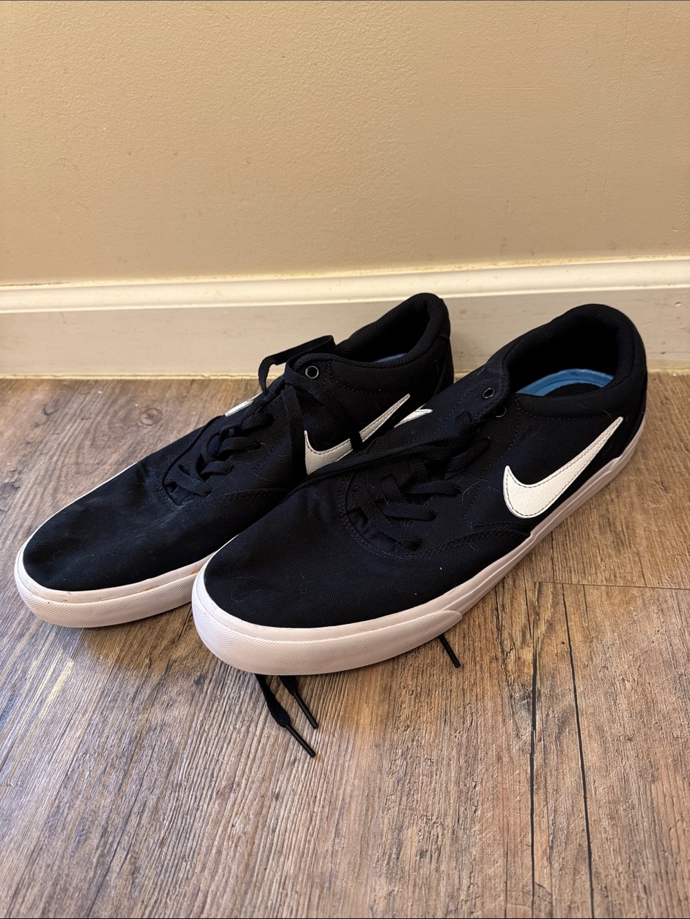 Nike Men’s Black Sneakers with White Swoosh